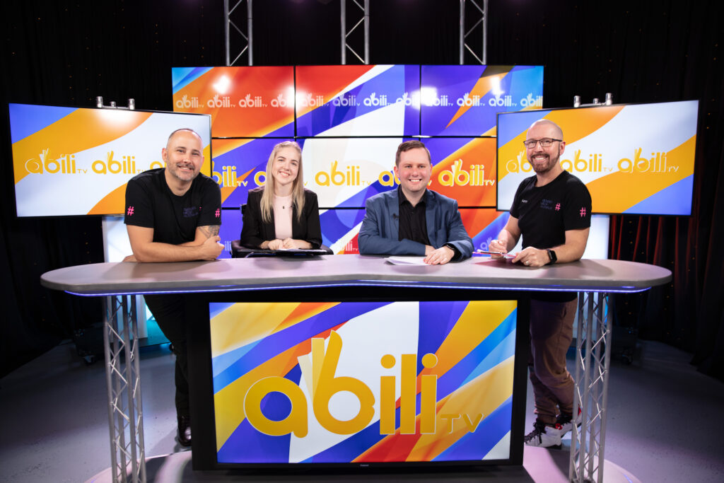 Photo of the cast and crew of Trending Media Australia and Redcliffe-based disability support non-profit ROPE posing for the show AbiliTV.