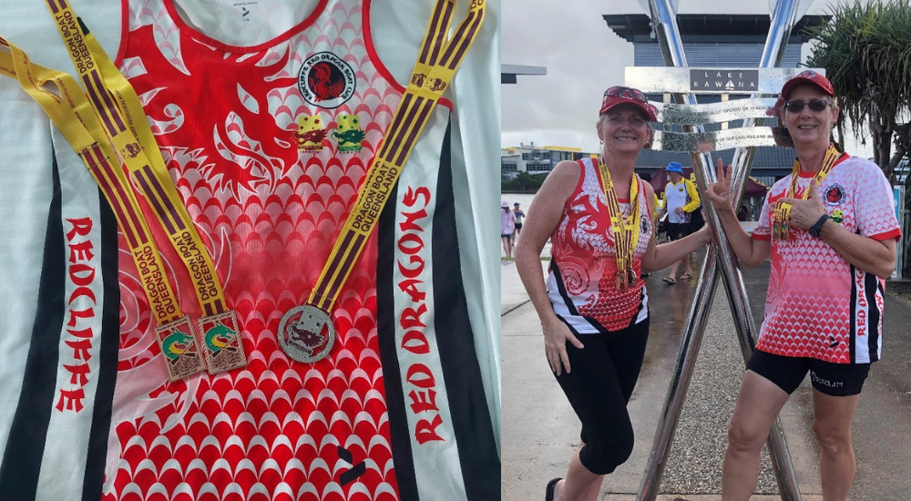 Photo of the members of the Redcliffe Red Dragon Boat Club posing for the camera and the winning medals