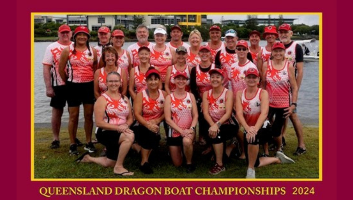 Photo of the members of the Redcliffe Red Dragon Boat Club posing for the camera