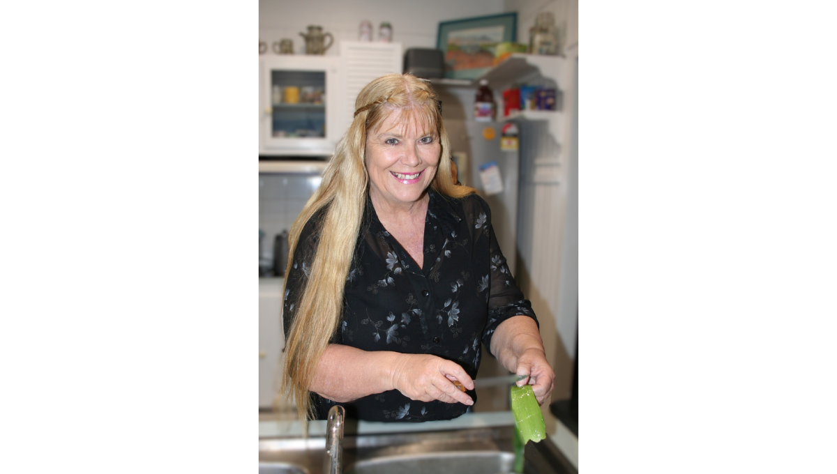 Angie getting gel from Aloe leaf